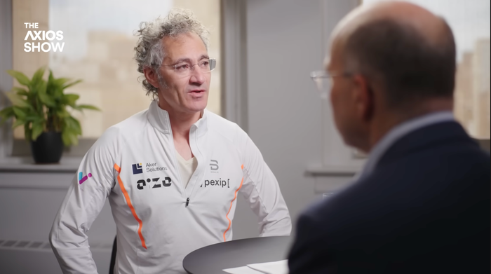 Alex Karp sits for an interview in the Palantir office