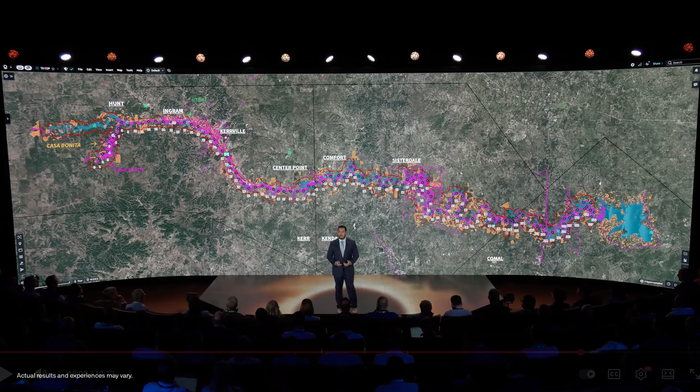 A presenter speaking on stage at Palantir's AIPCon.