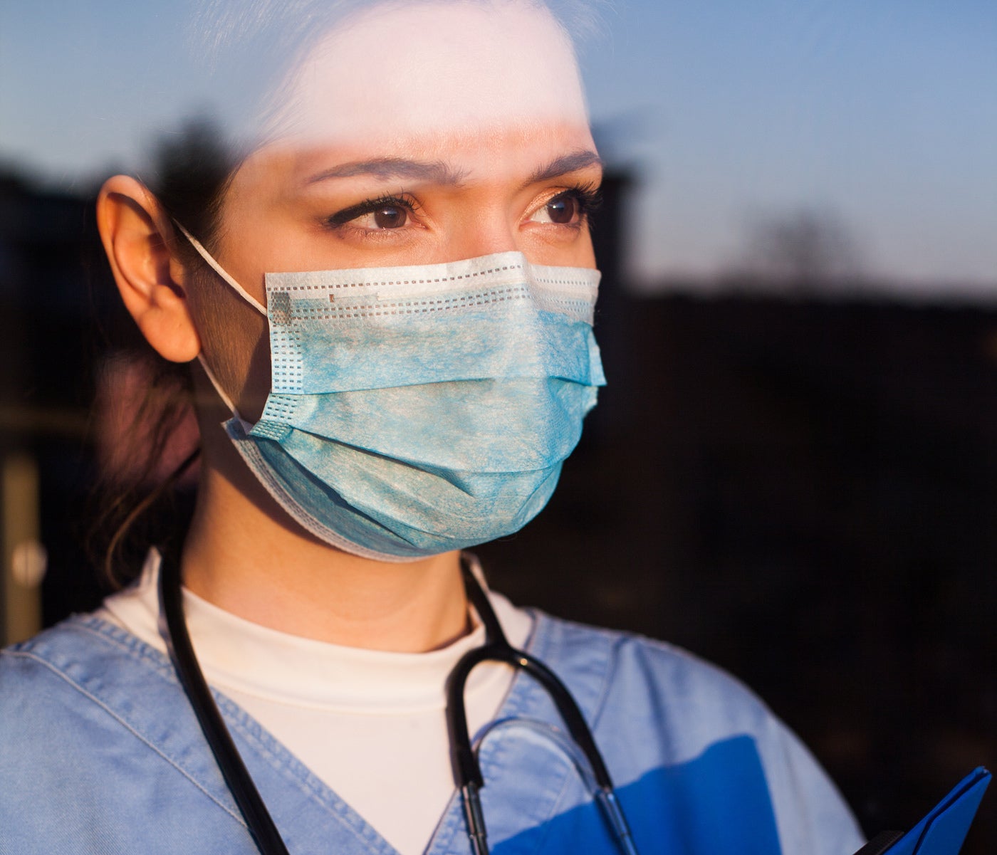 Medical professional wearing a mask outside